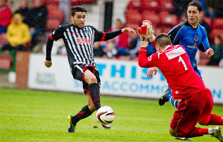 Faissal El Bakhtaoui slipps the ball past David Mitchell