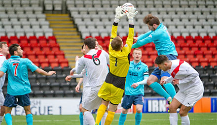 Callum Morris is beaten to the ball