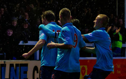 Jordan Moore celebrates with the travelling support