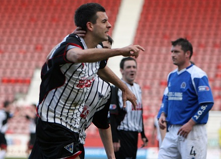 Steven Bell celebrates converting penalty v Queen of the South