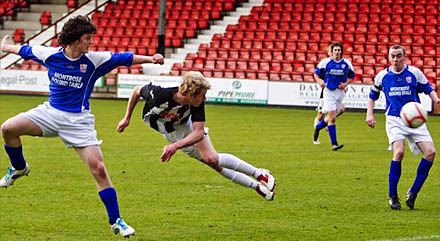 Blair Henderson sees his header saved