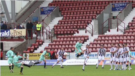 Derek Riordan launches in free kick that led to second goal