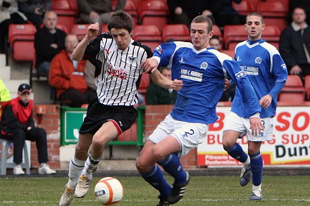 Stephen McKenna takes down Ross Campbell for penalty