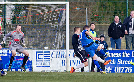 Grainger tries to keep out a third goal