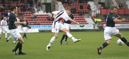 Calum Woods shoots at goal