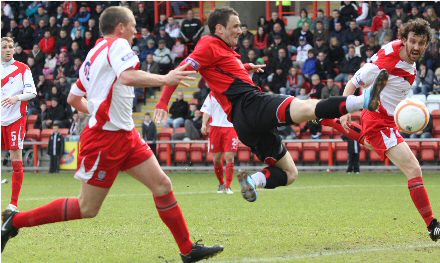 David Graham tries in vain to get on the end of a cross