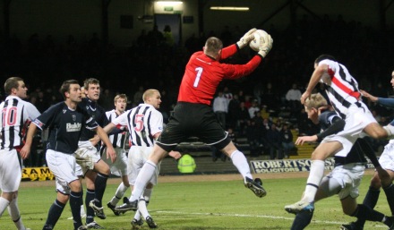 Rab Douglas holds a cross