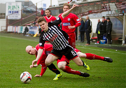 Alex Whittle goes down in challenge with Gerry McLauchlan