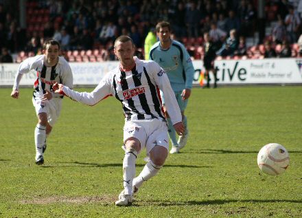 Andy Kirk scores from the penalty spot