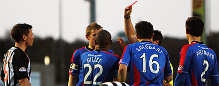 Inverness centre half Kenny Gillet is shown red