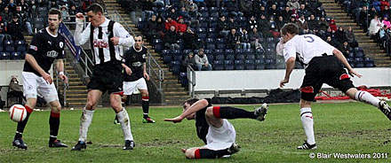 Chris Higgins heads on goal