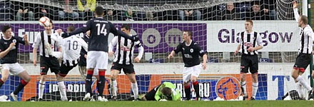 Chris Smith is injured at the Falkirk Stadium