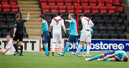 Stephen Husband lies felled as a free kick is awarded to Airdrie