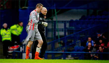 Ryan Scully is helped off by Kenny Murray