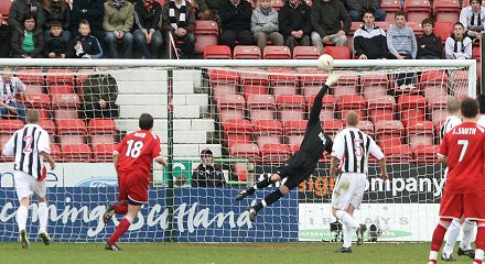 Paul Gallacher saves from Charlie Mulgrew