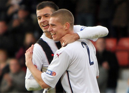 Calum Woods is congratulated by Steven Bell