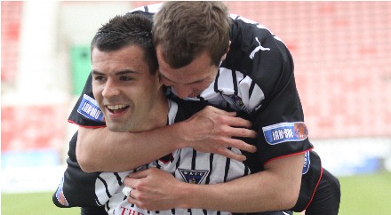 Graeme Holmes celebrates with Steven Bell