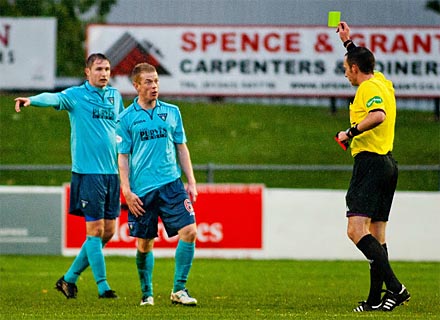 Andy Geggan is shown yellow card