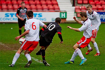 Craig Dargo puts in the shot that leads to the third goal