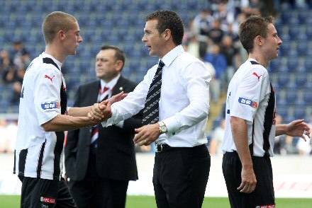 Jim McIntyre congratulates his players as they leave the field at the Falkirk Stadium