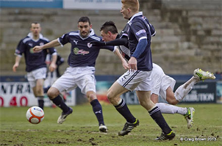 Jason Thomson barges over Joe Cardle