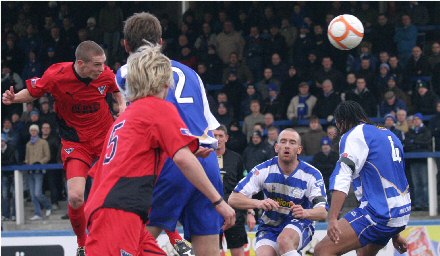 Calum Woods powers header at Colin Stewart