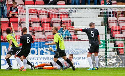 Martin Grehan turns in Mark Corcoran's drive