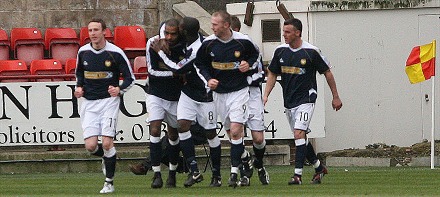 Freddie Daquin is congratulated for his goal